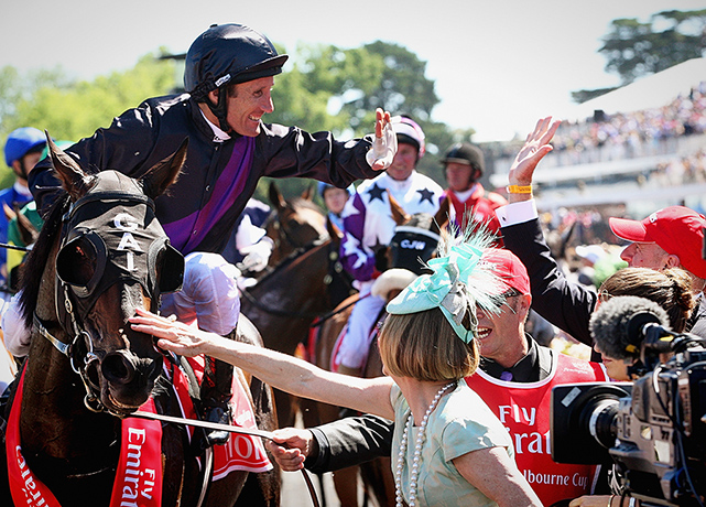 Melbourne Cup: Damien Oliver celebrates 