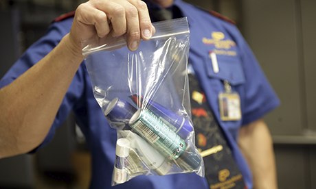 A security officer shows a plastic bag