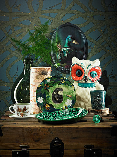 Homes - Vintage: collection of ceramic home accessories against dark wallpaper