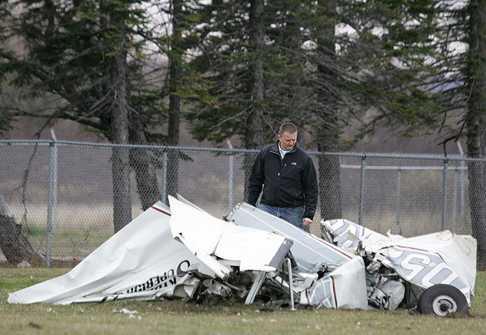 Skydiving incident: An FAA investigator examines the wreckage of a plane 