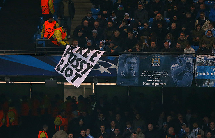 A Free Pussy Riot banner is removed