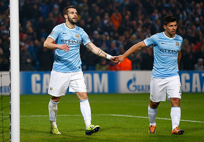 Manchester City's Negredo celebrates with Aguero 