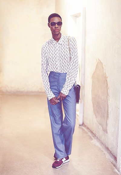 Fashion - boys and girls: androgynous woman in shirt and trousers