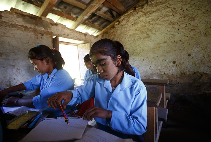 Werewolf syndrome: Manjura studies in a classroom at a school in Kharay