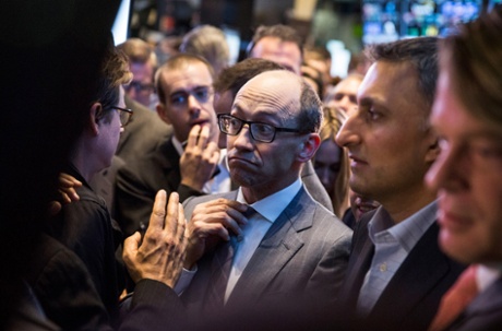 Twitter CEO Dick Costolo adjusts his tie while waiting to see what Twitter's opening market price will be on the floor of the New York Stock Exchange.