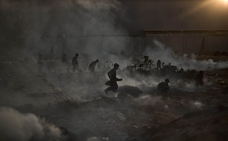 20 Photos: A burning field used by fruit and vegetable sellers to store their boxes