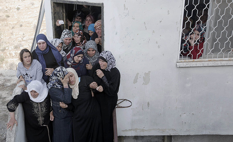 20 Photos: Palestinian female relatives grieve during the funeral of Hassan al-Turabi