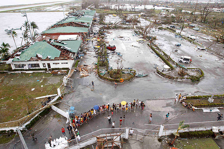 Typhoon Aftermath: Residents wait for relief goods