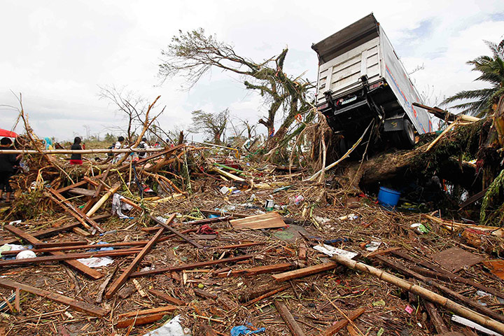 Typhoon Haiyan: A truck is seen slammed on a tree 