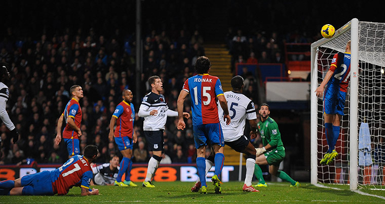 Saturday's matches: Dean Moxey attempts to clear the ball