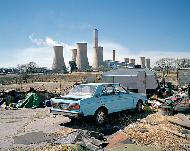 Big Pic - South Africa: car parked in front of South Africa mining town