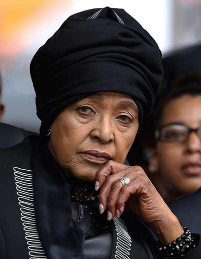 Memorial for Mandela: Winnie Madikizela-Mandela, Nelson Mandela's former wife, listens to speaker