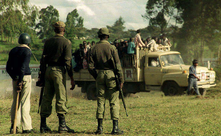 Kenya at 50: Members of the Kenyan Army watch opposition supporters