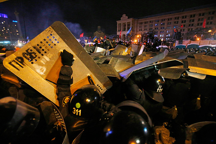 Ukraine protests: Ukrainian riot police storm Pro-European Union activists gather in their te