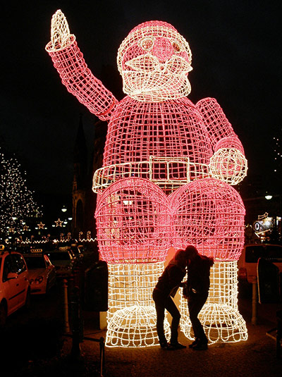 Your Pictures - Christmas: lit up santa with couple in foreground