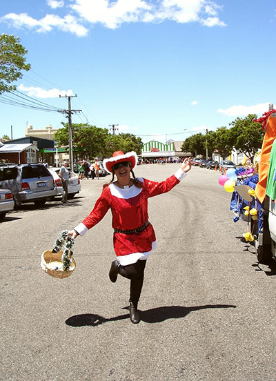 Your Pictures - Christmas: woman holding basket dressed in Santa outfit
