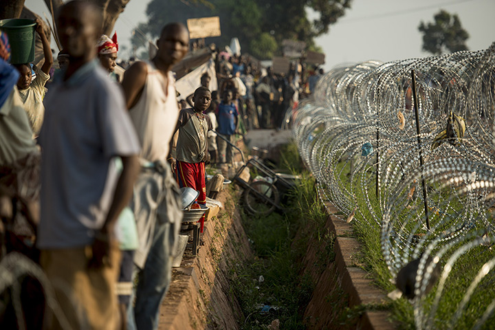 Central African Republic: People gather in a refugee camp near the airport in Bangui after fleeing vi