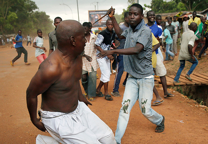 CAR conflict: A Christian man chases a suspected Seleka officer in civilian clothes with 