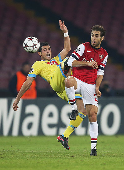 Napoli v Arsenal: Mathieu Flamini gets the better of Blerim Dzemaili
