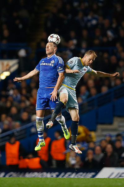 chelsea v steau: John Terry heads the ball