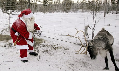 Santa pulling a reindeer