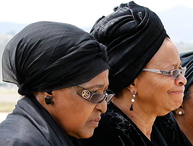 Mandela: Winnie Mandela watches with Graça Machel as Nelson Mandela's coffin arrives
