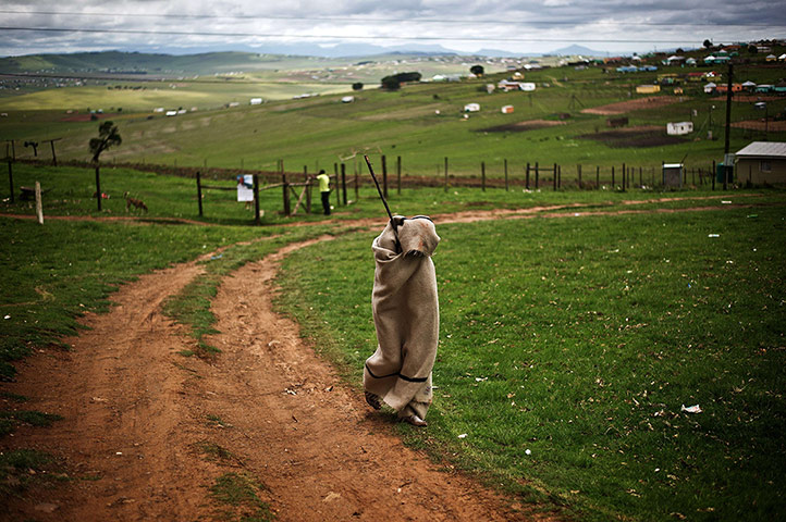 Nelson Mandela: A xhosa initiated walks through a field