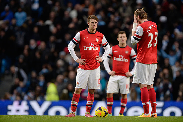 Arsenal Update 2: Dejected Arsenal players wait to restart after the 5th City goal