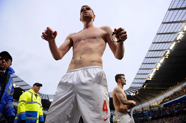Arsenal Update 2: Dejected Arsenal players Mertesacker and Wilshere throw their shirts into t