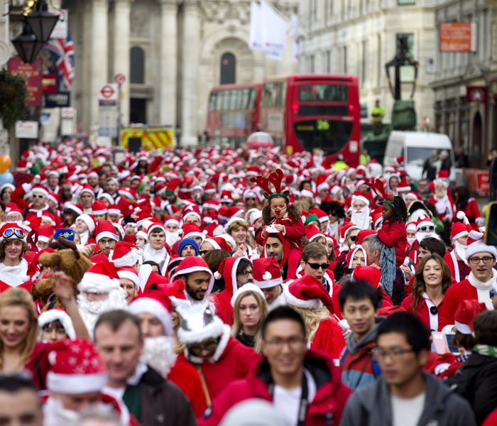 Revellers in Santa costumes set of throu