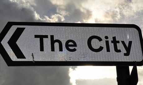 A sign points to the City of London financial district, in London