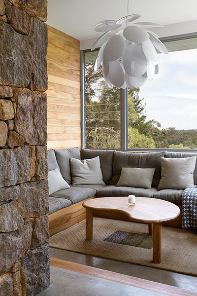 Homes - Perth House: interior of house with wooden walland large glass window