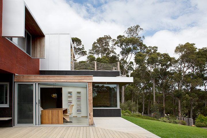 Homes - Perth House: exterior of architecturally designed house with trees in background