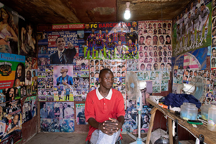 big picture - barbers: man in barber shop in Africa