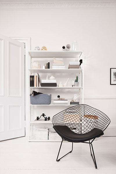 homes - glasgow house: interior of room with bookcase and black chair