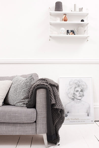 homes - glasgow house: interior of white room with grey chair and drawing on floor