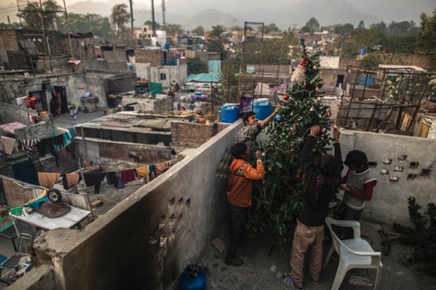 Christians find their Christmas spirit decorating a tree on the roof of their house in Islamabad in Pakistan.
