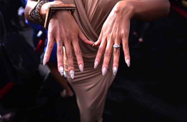 Actor Meagan Good shows her dramatic manicure at the Anchorman 2 Premiere in New York City in an alternative view to the usual red carpet photo opportunity.