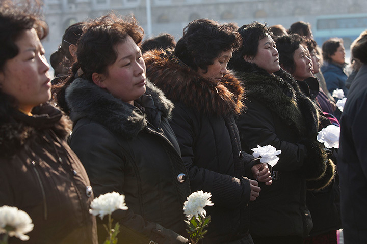 North Korea anniversary: Women gather in Kim Il Sung Square in Pyongyang to lay flowers beneath port