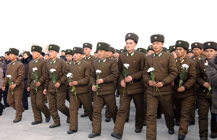 North Korea anniversary: Soldiers offer flowers at the statues of late North Korean leaders Kim Il-S