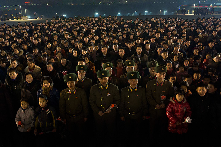North Korea anniversary: North Koreans gather together in Pyongyang on the eve of the second anniver