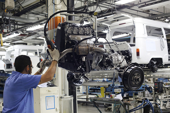 Volkswagen campers: A staff member moves the engine on the assembly line