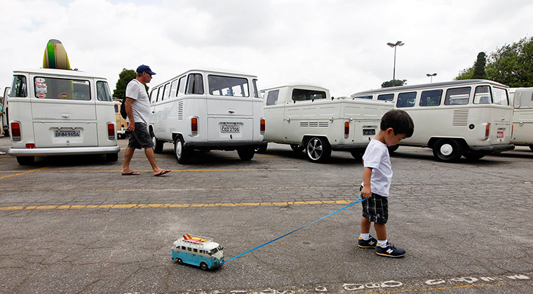 Volkswagen campers: A boy pulls along his Volkswagen Kombi toy