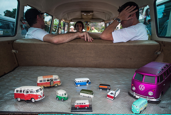 Volkswagen campers: Exhibitors rest inside a Volkswagen Kombi minibus with toy models