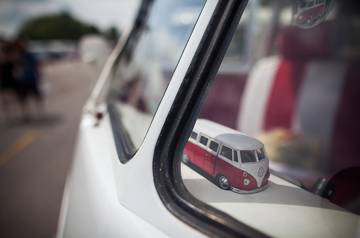 Volkswagen campers: A replica toy Volkswagen Kombi minibus sits on the dashboard 