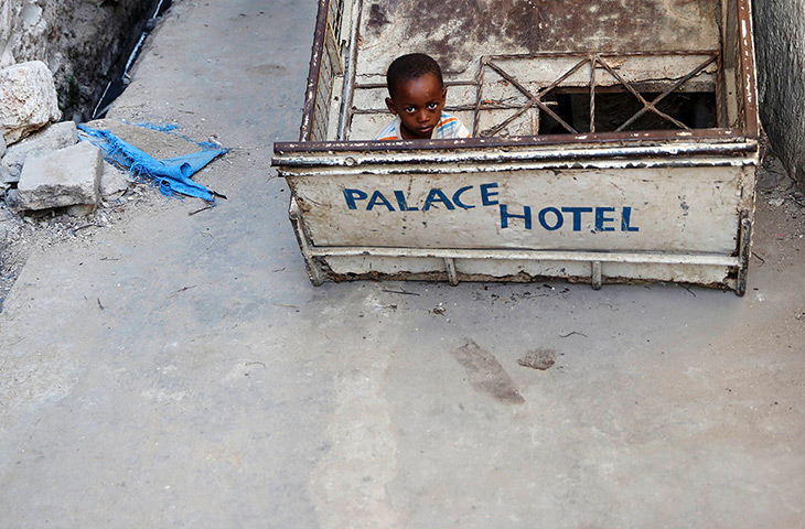 Goran Tomasevic: A boy plays in the main town on Lamu, an island in the Indian Ocean off the