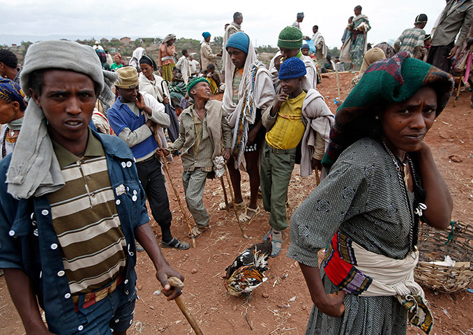 Goran Tomasevic: Orthodox Christians sell chickens for an Easter meal in Lalibela, Ethiopia 