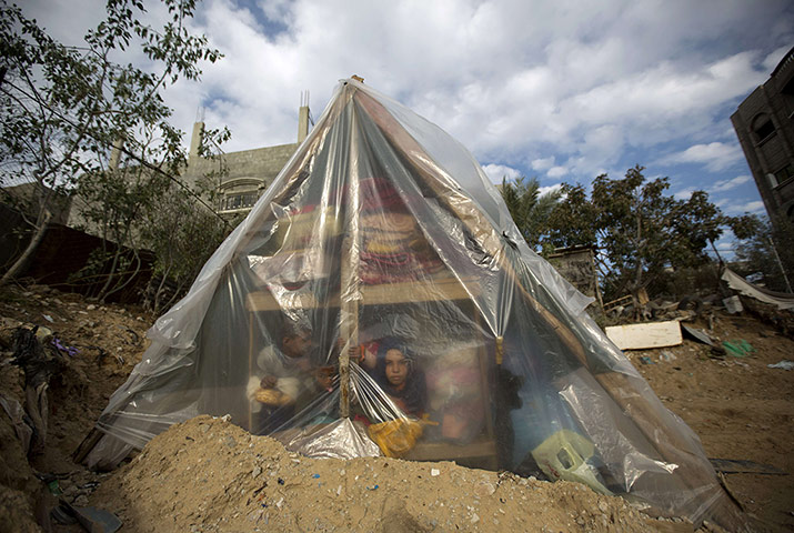 20 photos: A Palestinian family sits in a tent