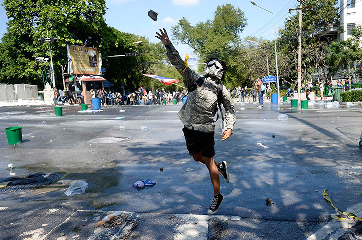 Thailand update: Protester throws rock at Thai riot police