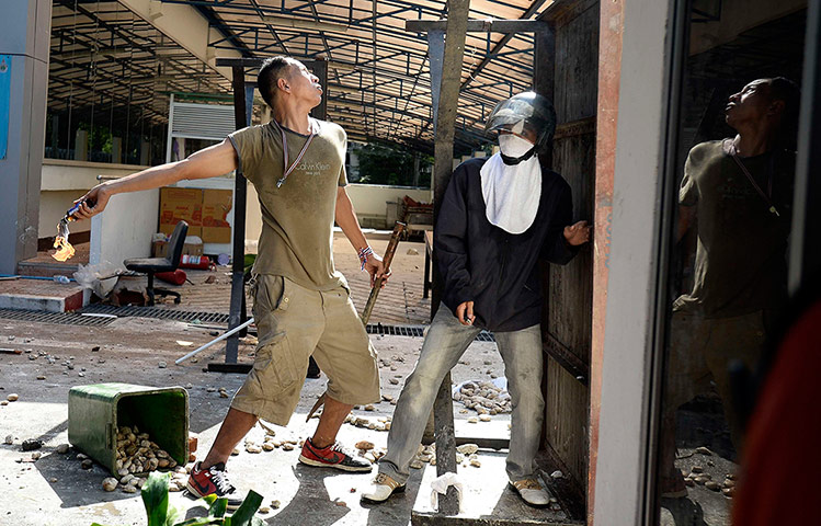 Thailand update: Protester throws a molotov cocktail at riot police